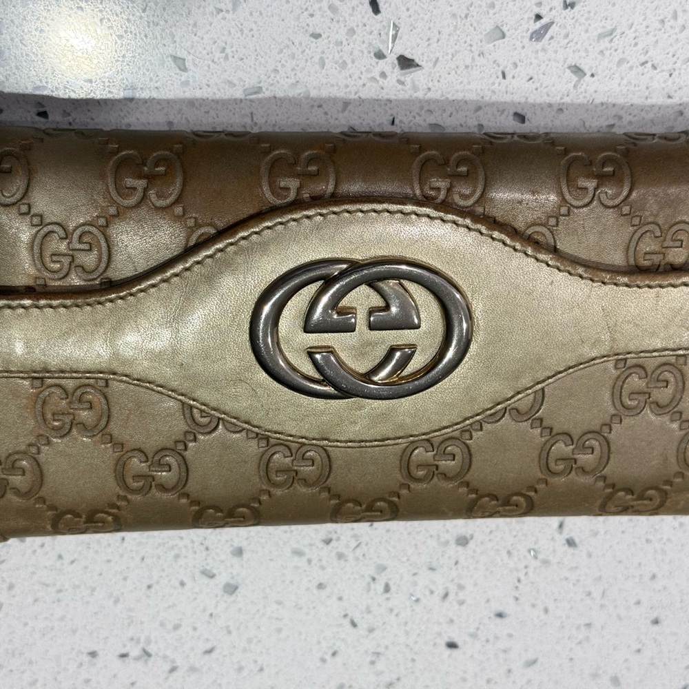 Gucci Gold Clutch with Iconic Monogram Design